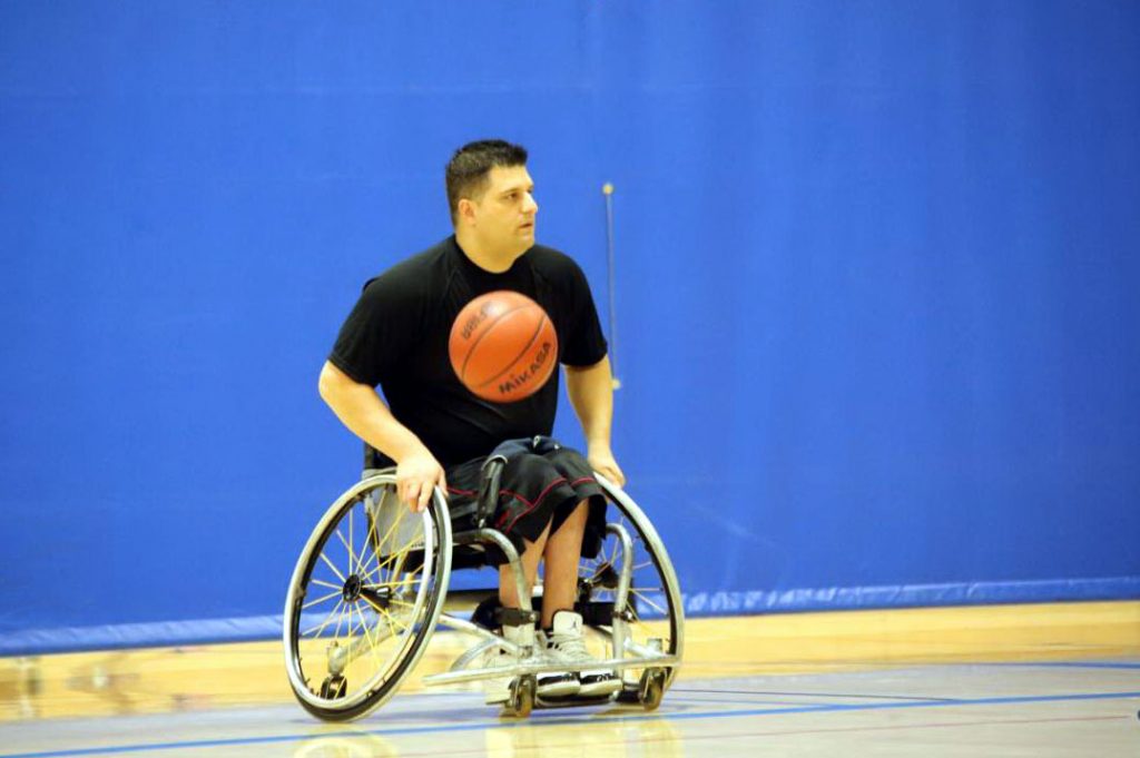 UCLA adaptive recreation coordinator Michael Garafola playing a game of wheelchair basketball on campus. Courtesy Michael Granola
