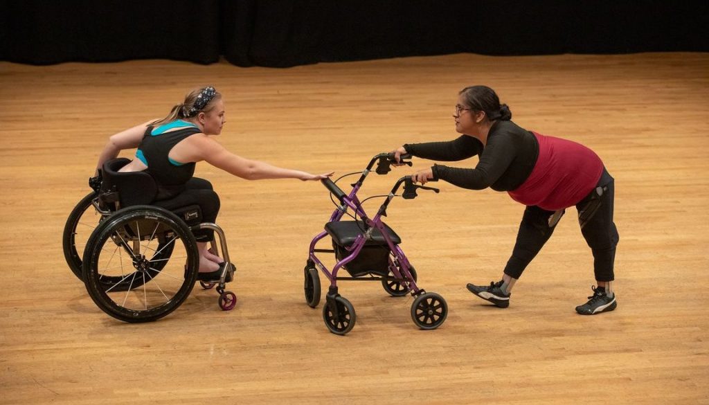 Harmanie Taylor, left, and Vanessa Cruz perform a duet during the Dancing Disability Lab at UCLA.