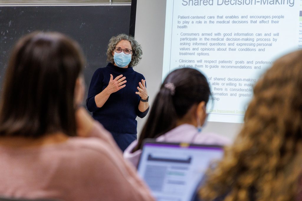 Photo of Professor Lauren Clark lecturing.