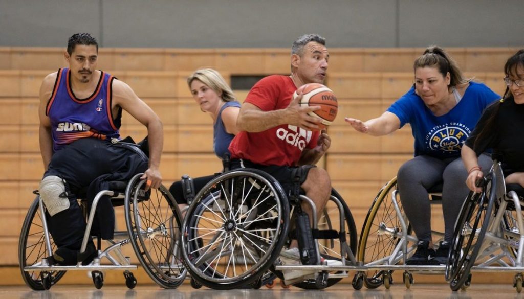Alvin Malave (center) was a dedicated athlete before his spinal cord injury but said he didn’t find community — like he has at UCLA Adaptive Recreation — when he was able-bodied. Photo credit: David Esquivel/UCLA