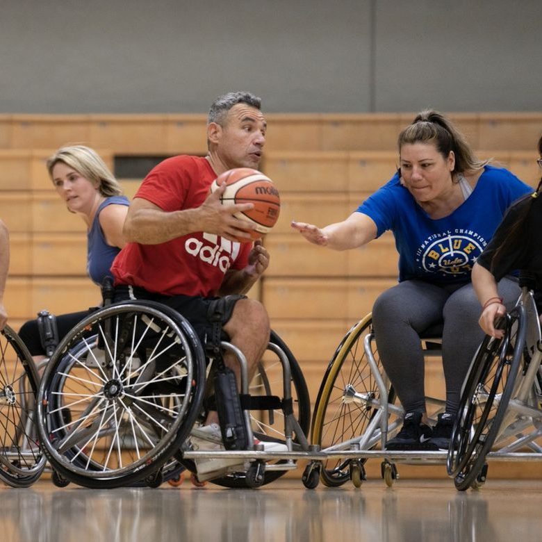 Alvin Malave (center) was a dedicated athlete before his spinal cord injury but said he didnâ€™t find community â€” like he has at UCLA Adaptive Recreation â€” when he was able-bodied. Photo credit: David Esquivel/UCLA