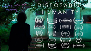 A figure stands to look at a house. The image is dark and green toned. It includes the title "Disposable Humanity" and the accolades the film has won.